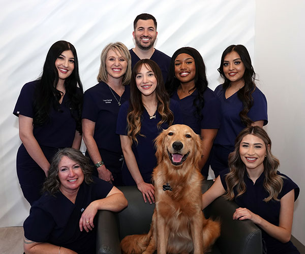The Love Dental team with Grizzly, the office dog