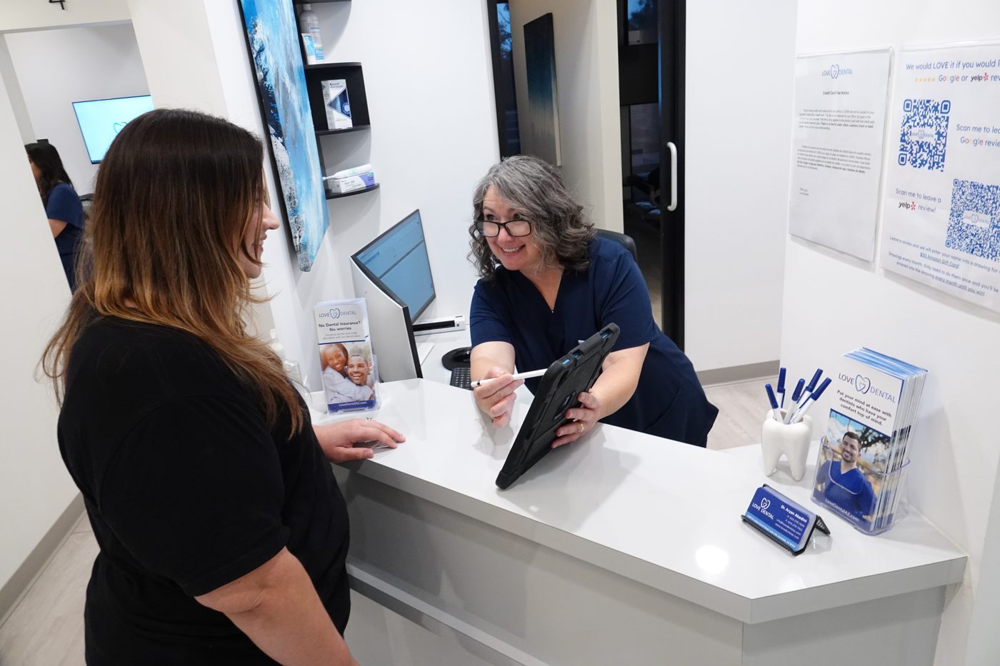 A warm goodbye at the Love Dental front desk