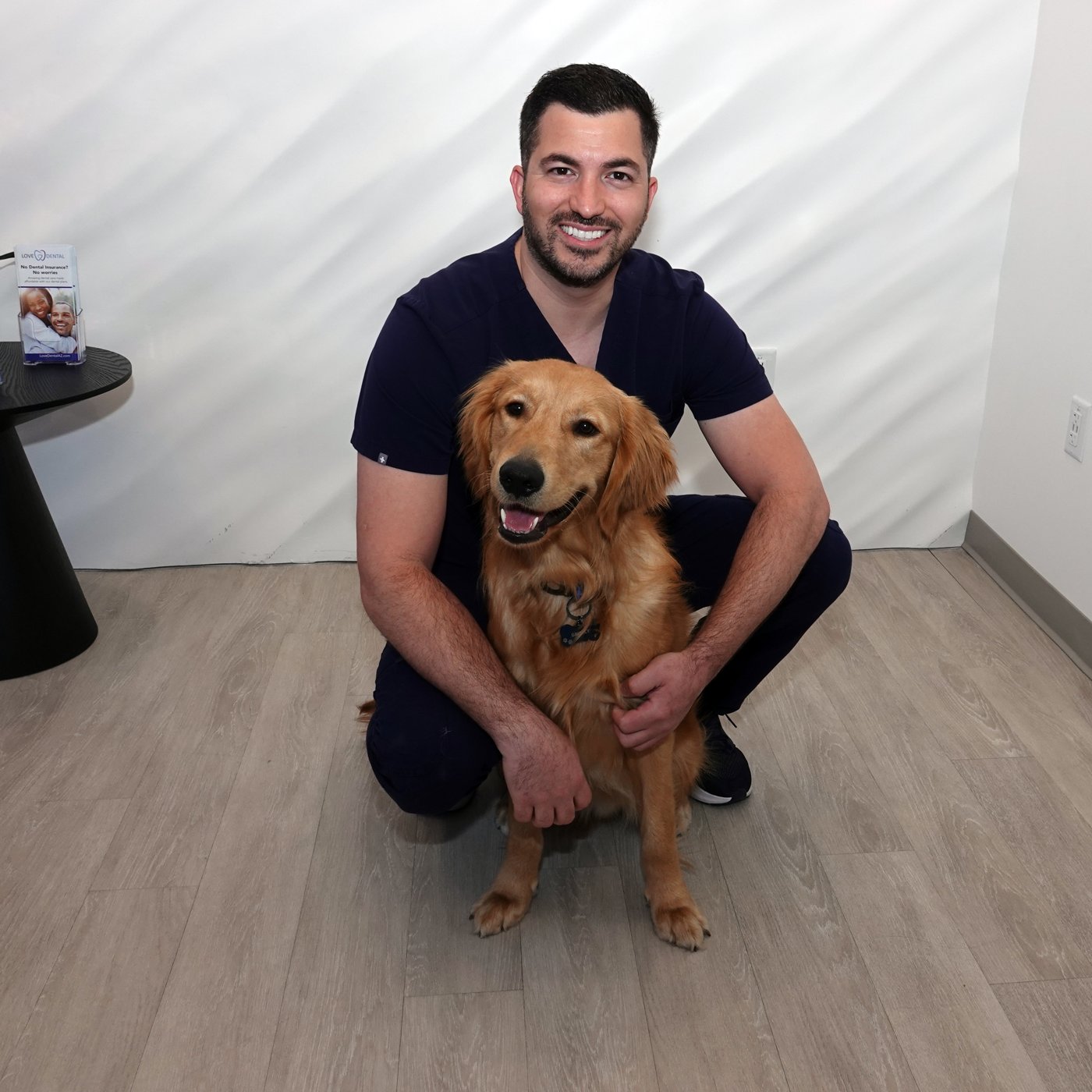 Dr. Abedini with Grizzly, our therapy dog
