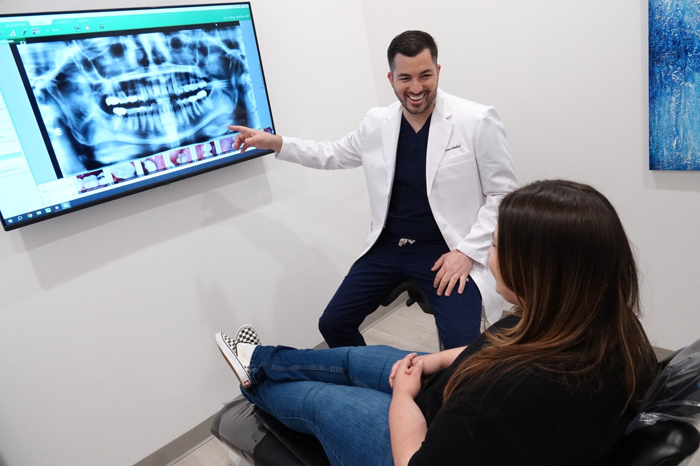 Dr. Abedini sharing a laugh with a patient at Love Dental